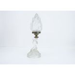 An Art Deco frosted glass table lamp, modelled as a kneeling nude female with draped robes