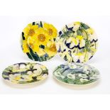 A set of four contemporary stoneware Jonathan Cox floral decorated plates, two of pansies, another
