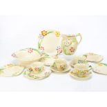 A collection of Grindley Art Deco pottery tea and dinnerwares, serving bowl, jug, three cups and