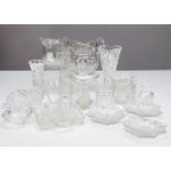 A collection of cut glassware, including a continental tapered cut glass flower a vase on a circular