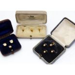 Three cased sets of dress buttons, one with mother of pearl back, all gold (3)