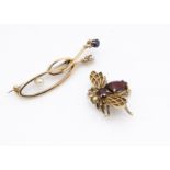 A 9ct gold and garnet bug brooch, the abdomen and body with faceted pear and oval almandine