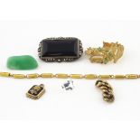 A small quantity of gold, including a college charm pendant, an onyx and marcasite brooch, a loose