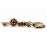 A 19th Century garnet ring, the cushion cut stone within a leaf and scroll mount, ring size T,