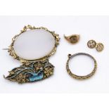 An agate and gilt metal 19th Century oval brooch, with scroll work mount, a gilt metal chased