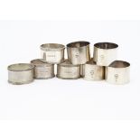 A set of four 1960s silver oval napkin rings from JR, together with a set of four silver napkin