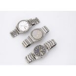 Three c1970s Seiko 5 automatic stainless steel gentlemens wristwatches, one with black dial, another