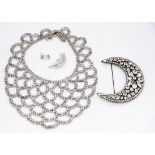 A paste set base metal fringe necklace, with open shaped chest piece, a large modern crescent