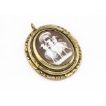 A 19th Century pinchbeck rotating shell cameo pendant converted from a brooch, decorated with the