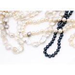 Two large strings of Baroque pearls, one with silver heart clasp, the other with a circular snap,