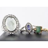 Three contemporary gold and silver gem set rings, including an emerald 9ct gold example, 1.8g,