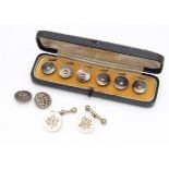 A cased set of mother of pearl and gold buttons, in a green leather case by Terry & Company,