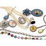 A small quantity of costume jewellery, including a base metal oval locket with anchor, a white metal