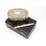A cased 1960s silver mounted comb and clothes brush set