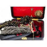 A collection of costume jewellery, including a black glass and gilt metal fringe work necklace,