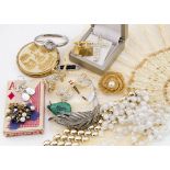 A collection of costume jewellery, including necklaces, gilt metal bracelets, brooches, compacts and