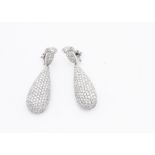 A pair of 18ct white gold continental diamond drop earrings, marked Cion Cappa, the diamond