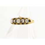 An 18ct gold opal and diamond five stone dress ring, the three cabochon white precious opals