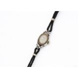 A c1960s Longines 14ct gold cased lady's cocktail dress wristwatch, 14mm wide oval case set with