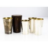 A set of 1920s silver travel or campaign beakers by HEB FEB, the stacking cups in leather case