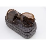 A cased pair of Bottega Veneta lady's sunglasses, the brown frames with gilt butterfly decoration in