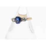 An Art Deco sapphire and diamond three stone dress ring, the oval mixed cut claw set sapphire