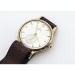 A 1940s Omega automatic 9ct gold cased gentleman's wristwatch, 31mm, silvered dial with batons and