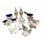 A collection of silver and silver plate, including a pair of silver salts with blue glass liners,