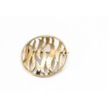 A 9ct gold circular brooch, of pierced scroll design, 4.1cm diameter, 9.6g