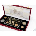 A Royal Mint Queen Elizabeth II The Gillick Portrait Collection coin set, in a fitted red case