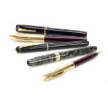 Two vintage Conway-Stewart fountain pens, together with a Sheaffer fountain pen and pencil set and a