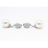 A pair of 18ct gold diamond and cultured pearl drop clip earrings, the large white pearls
