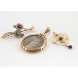 An Edwardian gold double sided circular open locket, with egg and dart decoration, together with