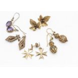 A collection of continental yellow metal and gold earrings, including a pair of filigree double