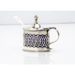 A George V silver mustard, with blue glass liner and Victorian silver mustard spoon marked Exeter