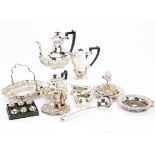 A group of silver plated items, including a four piece tea set, chamberstick, pair of bottle