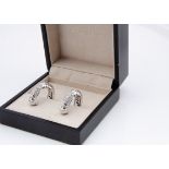 A pair of Bvlgari 18ct white gold and diamond encrusted clip earrings, of hoop design with a chevron