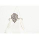An 18ct gold diamond set pear shaped dress ring, the pave set diamonds in a white gold setting and