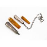 Two George V silver cheroot holders, the larger 7cm, engraved From WAT, the shorter 5.5cm, on chain,