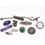A quantity of silver Victorian and later brooches, including a pair of aesthetic earrings, a gold