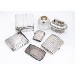 A George V silver vesta and cigarette case, together with a curved silver card case, a silver