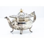 A late Victorian silver bachelors teapot by J & T, floral design to upper rim and on four