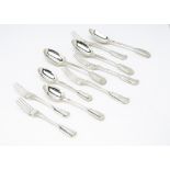 A part canteen of Victorian silver cutlery by George Adams, fiddle and thread pattern and bearing