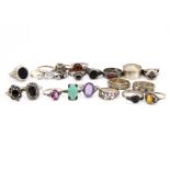 A collection of silver and gem set dress rings, including onyx, amber, cornelian and paste (21)