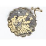 A Meiji period Japanese Amita Damascene brooch, decorated with an exotic bird with golden wings