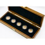 A Royal Mint five full gold sovereign George V Gold Mint Mark Set, in fitted wooden box, with