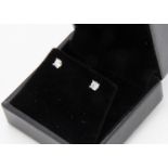 A pair of 18ct gold diamond set ear studs, total diamond weight 0.40ct
