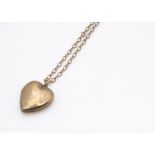 A 9ct gold oval linked chain, and a 9ct gold front and back heart shaped locket, 32cm, gold chain