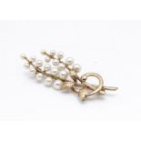 A 9ct gold cultured pearl floral style brooch, 5.6cm x 2cm, 6.7g