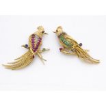 Two continental yellow metal jewel encrusted exotic bird brooches, set with rubies, diamonds,